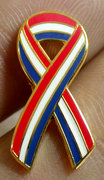 red white and blue ribbon pin