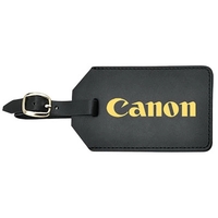 Luggage tag with detailed stitching and gold plated buckle that includes......
