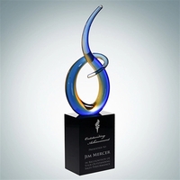 Hand-blown glass swirl sculpture award with blue and yellow accents...