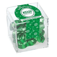Signature clear cube container filled with 2.5 oz. of chocolate shamrocks;......