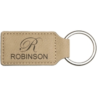 2.75" x 1.25" x .1875" premium leatherette keychain.... from ASI 92531 Unique...