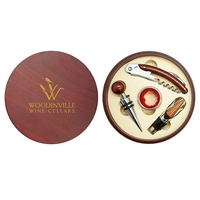 Corkscrew, bottle stopper, drip ring and a wine pourer boxed in... from ASI...