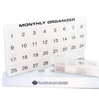Monthly pill organizer with removable 4-day compartments for portability.......