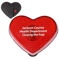 Heart shaped button with sturdy clip for attachment and blinking light.......