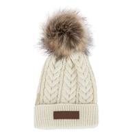A cozy cable-knit winter hat with a faux fur pom and... from ASI 30250 AZX...