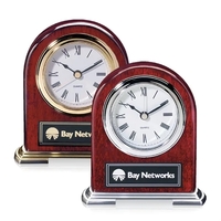 Arch shape rosewood clock with metal base and chrome /Gold accents.... from...