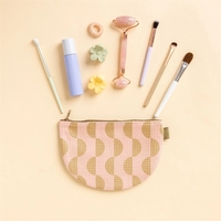 The Slice Pouch is a flat, half-moon shaped pouch with a... from ASI 74710 Numo