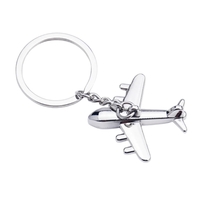 Airplane shaped metal keychain with laser engraving on one location... from...