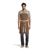 Bib apron available in patterns and contracting colors, featuring two...