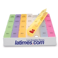 This 24/7 medicine tray organizer with rainbow-color pill boxes makes a......