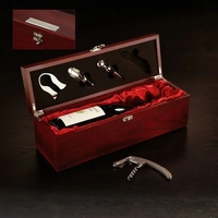 Four useful wine tools in a satin-lined, rosewood-finished wooden box.......