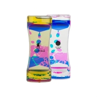 5.5" x 2.125" plastic hourglass shaped liquid motion desktop accessory.......