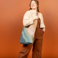 A crossbody, hobo-style tote, this bag fits snugly against your person......