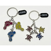 Dangling key tag with foot or turtle charms.... from ASI 40610 Perry...