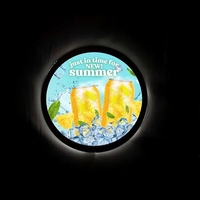 23" round LED display with artwork printed on white poly-carbonate...