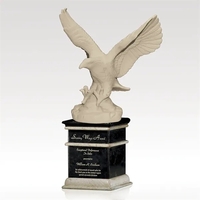 Porcelain award with perched white eagle, supported by ebony and...