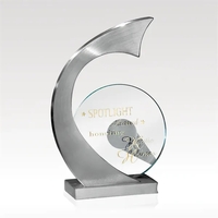 Satin stainless sculpture award that features a jade glass disc that... from...