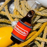 Slap-on drink coolie adjusts to fit. Sharkskin neoprene. RealTree or Mossy......