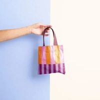 A short, flat tote, the Itty Bitty was designed to simplify... from ASI 74710...