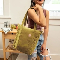 Large, gusseted, two-handled tote with zipper closure that measures 15" W......