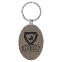 3" x 1 3/4" gray PU leatherette/metal oval keychain with metal... from ASI...