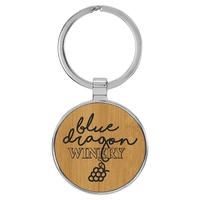 1 1/2" x 1 1/2" bamboo PU leatherette/metal round keychain with... from ASI...