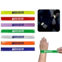 Slap bracelet with reflective coating; reflects against light in the dark.......