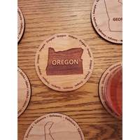 3.5" round wooden coasters with State of Oregon shape in the... from ASI...