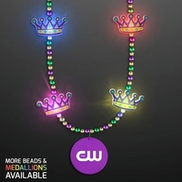 Festive LED bead necklace with vibrant purple, gold, and green beads... from...