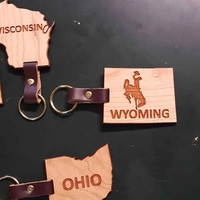 2" Wyoming shaped hardwood keychains with laser engraving; USA-made...