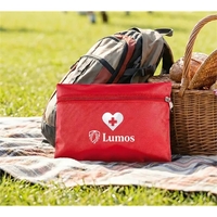 A compact red first aid kit with essential supplies, perfect for... from ASI...