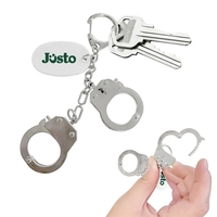 Handcuff keychain with a white oval plastic tag, iron construction, 1... from...