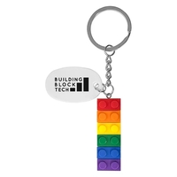 Building block keychain with yellow base and six different colors that......