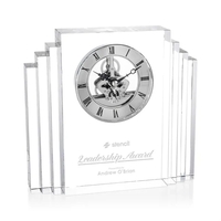 A stunning optical crystal clock featuring a distinctive stepped,...
