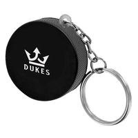 1.5" hockeypuck shaped stress reliever keychain.... from ASI 63549 Jornik...