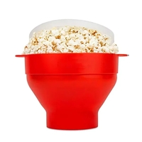 Microwavable, heat-resistant silicone popcorn bowl pops, cools safely, &...