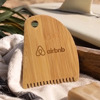 Bamboo surf comb that measures 3.9" x 3" with customized engraving.... from...