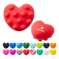 Heart-shaped silicone fidget ball with push-pop, dimpled surface.... from ASI...