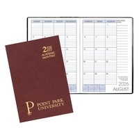 Saddle-stitched academic monthly desk planner with leatherette cover.... from...