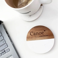 Sophisticated marble & wood coaster set elevates your table. Perfect for......