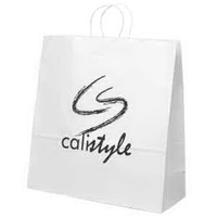 White kraft paper shopper with twisted paper handles and serrated cut... from...