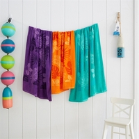 Mid-weight colored beach towel made of 100% cotton that measures 35"... from...