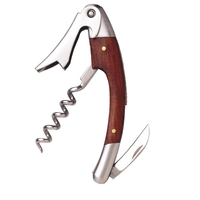 Stainless steel waiter's corkscrew that's curved with a burgundy-colored...