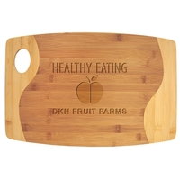 Two-tone cutting board measuring 11.75" x 17.75" and made of bamboo.... from...
