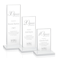 This illustrious Starfire Crystal award stands upright on an elegant White......