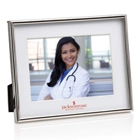 The metallic, slim-line frame of polished chrome edges a deep-set white......