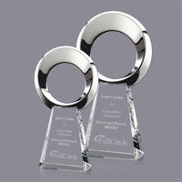 Magnificent Cast Metal Award mounted onto a tall Optical Crystal Base.......