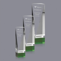 The angled rectangular optical crystal tower radiates light while reflecting...