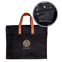 24 oz. Black canvas tote bag with sturdy handles, interior hanging... from...