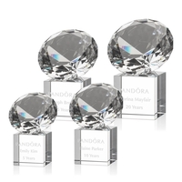 This award features a stunning diamond gemstone mounted onto a reflective......
